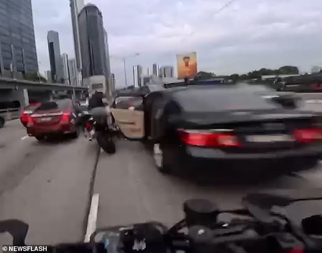 Two-Year-Old's Sudden Door Opening Causes Motorcycle Crash on Jalan Tun Razak Motorway in Kuala Lumpur, Malaysia