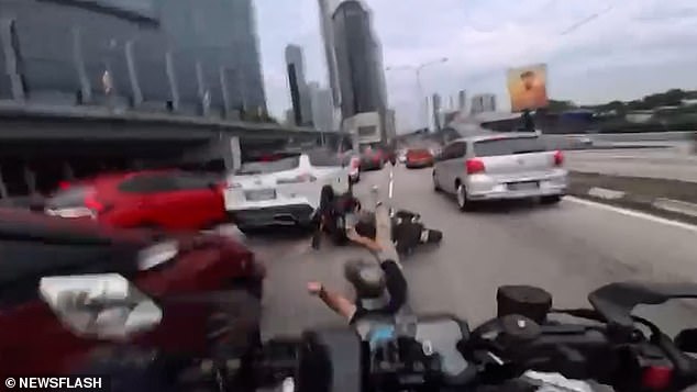Two-Year-Old's Sudden Door Opening Causes Motorcycle Crash on Jalan Tun Razak Motorway in Kuala Lumpur, Malaysia