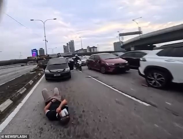 Two-Year-Old's Sudden Door Opening Causes Motorcycle Crash on Jalan Tun Razak Motorway in Kuala Lumpur, Malaysia
