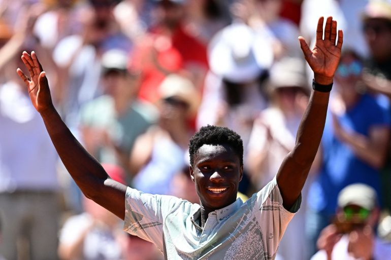 French teen Moise Kouame becomes youngest male Grand Slam winner in 17 years.
