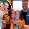 Conjoined Twins Abby and Brittany Hensel Seen Holding Newborn in Minnesota Parking Lot, Sparking Speculation About Motherhood